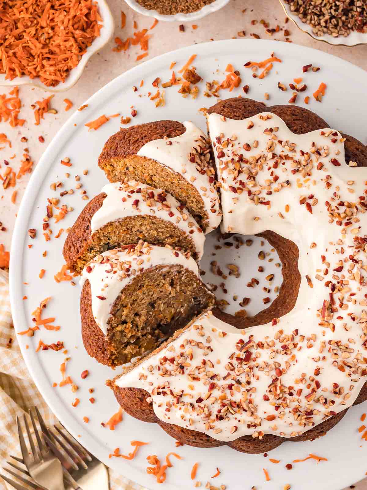 Over head shot of slices of carrot bundt cake on a white cake stand.