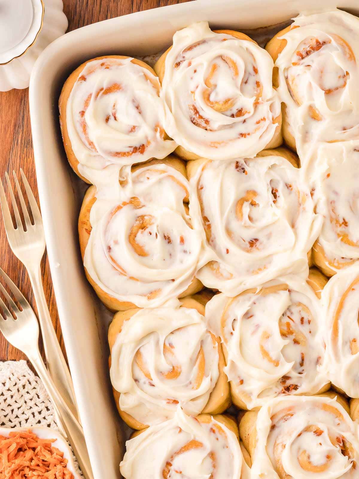 A tray of carrot cake cinnamon rolls.