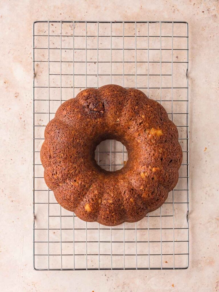 Cooked carrot bundt cake cooling on a wire rack.