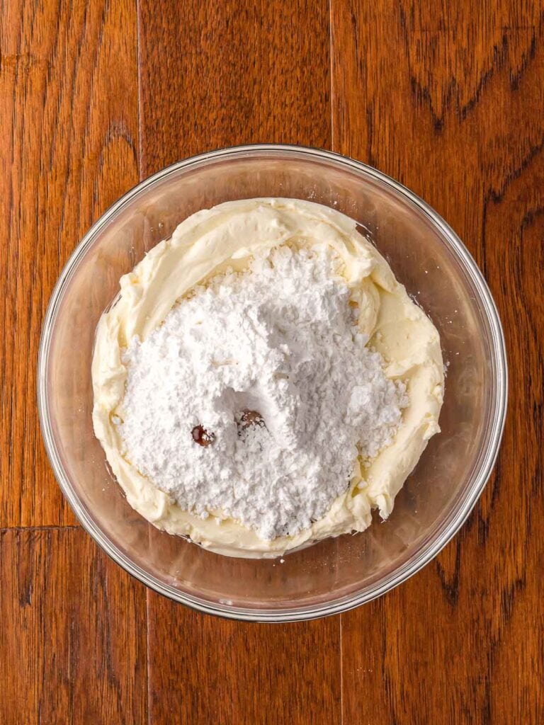 Cream cheese glaze ingredients in a bowl.