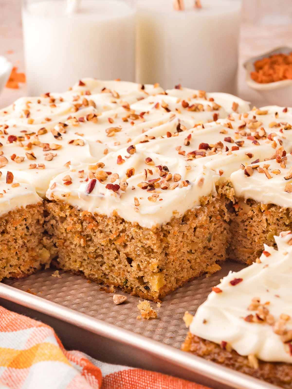 Sliced of carrot cake sheet in a sheet pan.