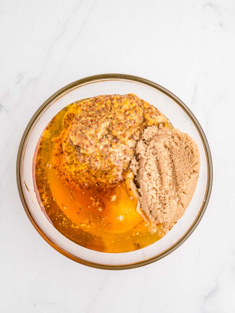 Mustard and honey mixed in a bowl.