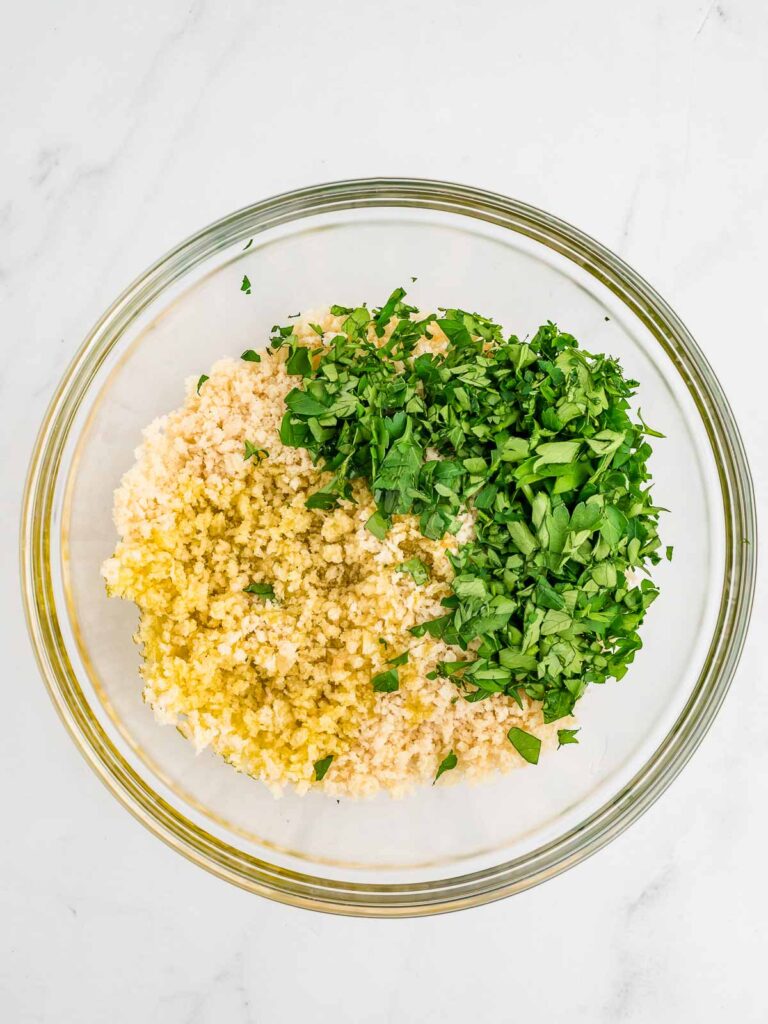 Herbs and panks mixed in a bowl.