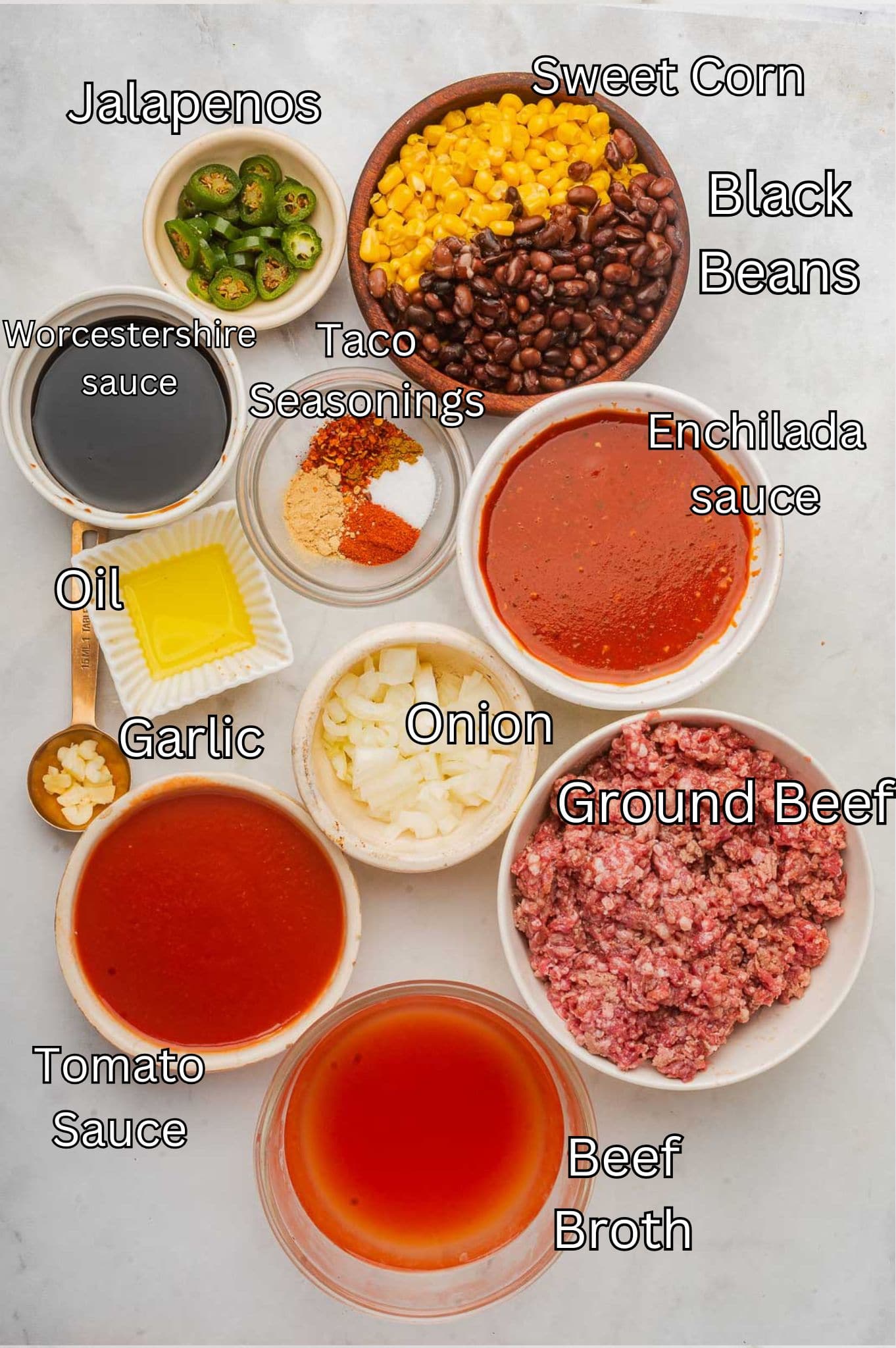 Ingredients for Taco Sloppy Joes laid out on a white table.