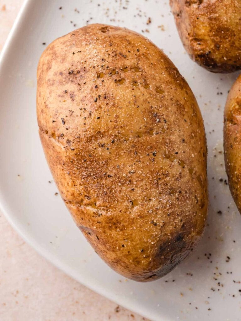 Seasoned potato skin sprinkled with salt and pepper before cooking.