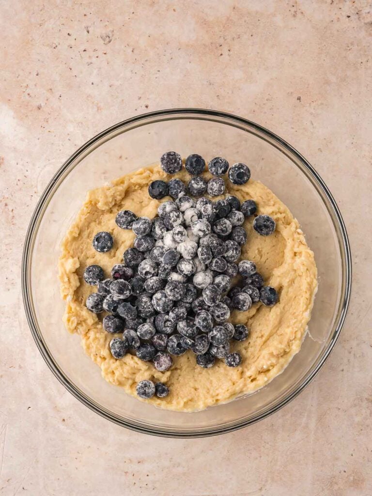 Blueberries added to the muffin batter just before folding them in.