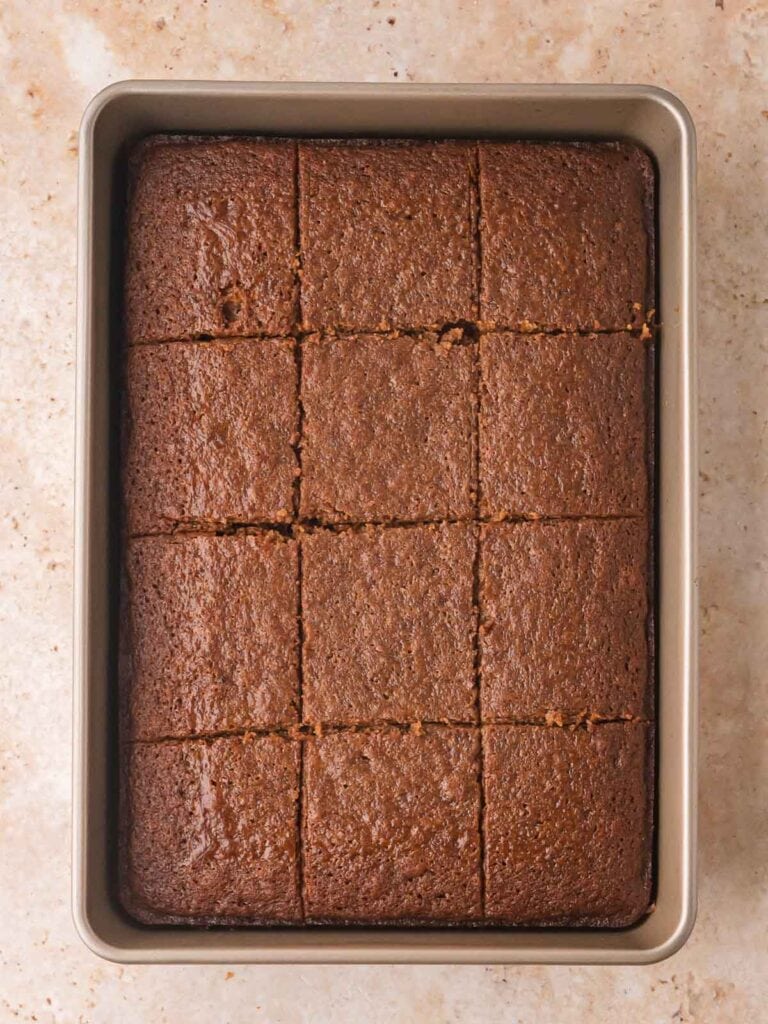 Freshly baked Gingerbread Cake cut into squares in the pan, ready to serve.