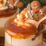 Layered gingerbread trifle in a glass trifle bowl.