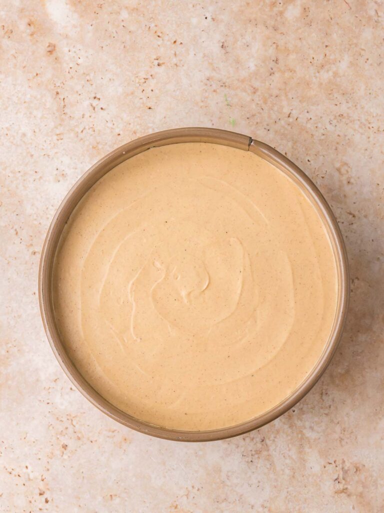 Creamy gingerbread cheesecake mixture in bowl