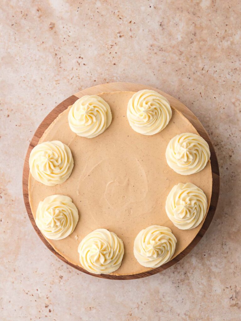 Creamy gingerbread cheesecake topped with swirls.