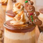 Layered gingerbread trifle in a glass trifle bowl.