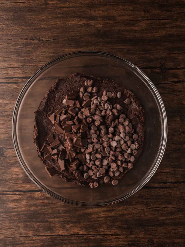 Double Chocolate Chunk Cookie dough with chopped dark chocolate and chocolate chips ready to fold together.