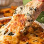 Baked Spinach Artichoke Dip By Tessie's Table.