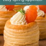 Close-up of a smoked salmon vol au vent with piped cream cheese and dill by Tessie's Table.