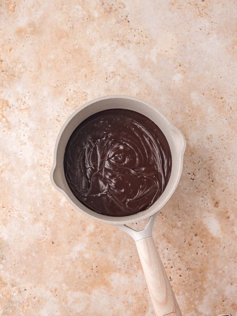 Powdered sugar and vanilla mixed into the cocoa and butter mixture until smooth.