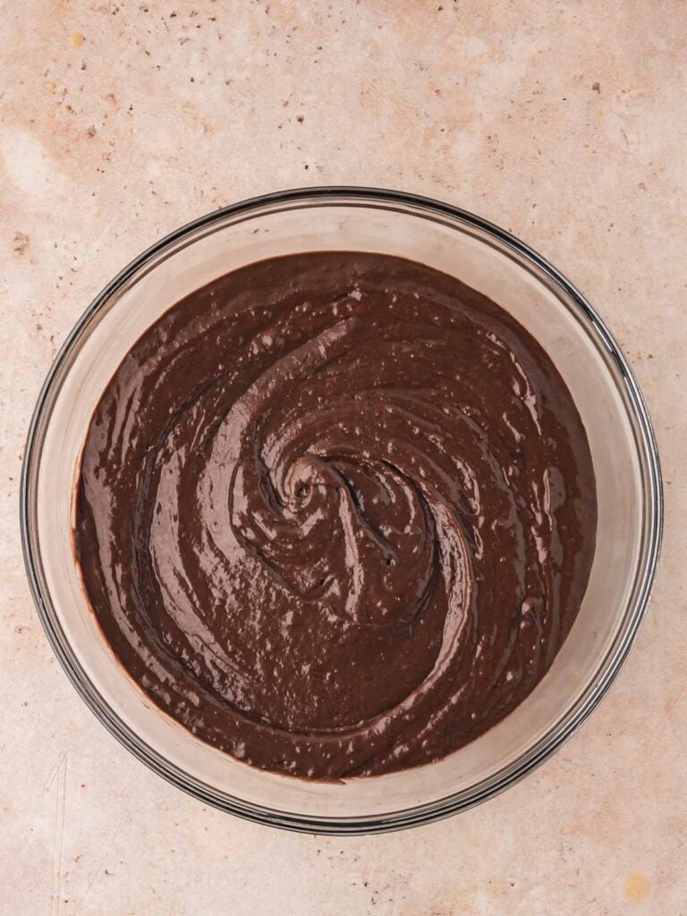 The cooled cocoa mixture added to the cake batter and mixed well.