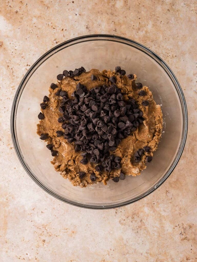 Chocolate chips folded into brown butter chocolate chip cookie dough.