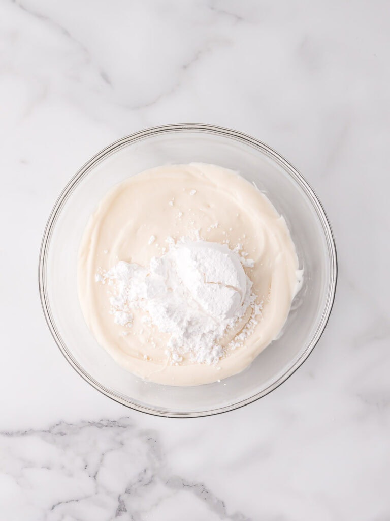 Powdered sugar added to fondant filling mixture.

