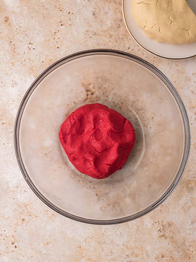 Red pinwheel cookie dough after food coloring has been mixed in