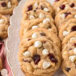 Soft and chewy white chocolate cranberry cookies arranged on a platter ready for serving