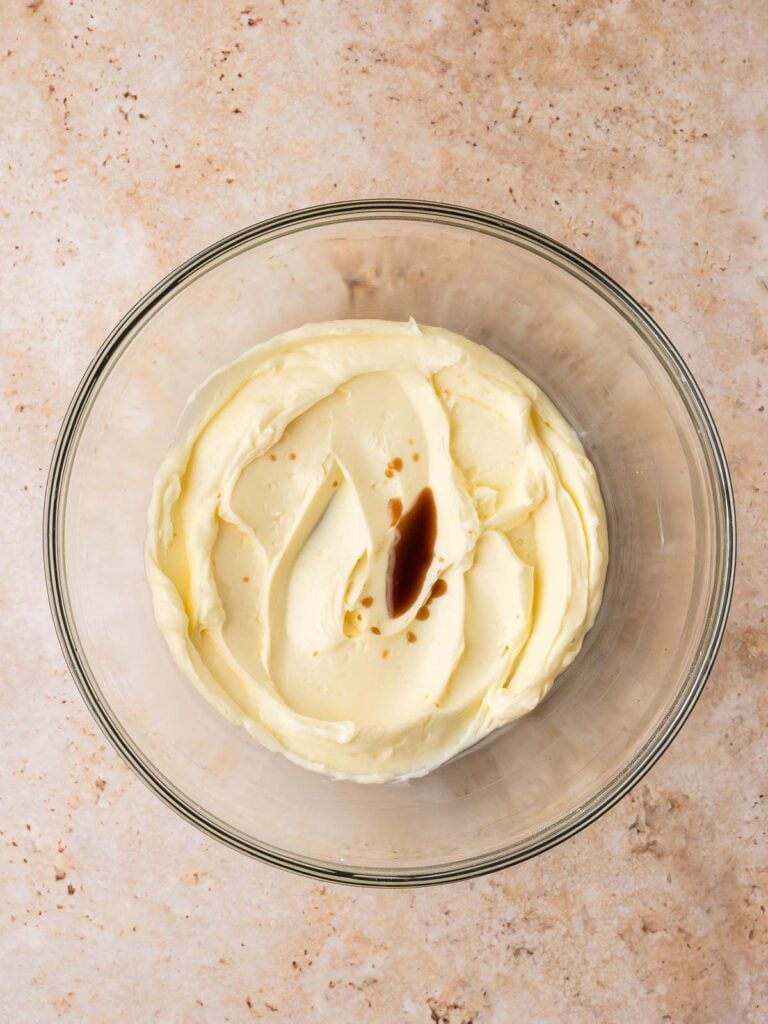 Vanilla extract added to the creamed butter mixture.