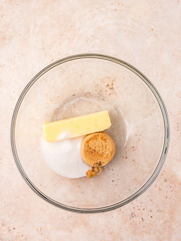 Butter and sugars in a bowl ready to be creamed for carrot cake cookies.