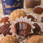 Chocolate Baileys truffle cut open showing rich chocolate ganache center.