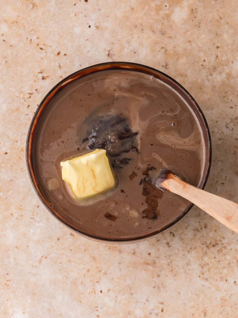 Warm chocolate mixture with butter melting while making Chocolate Baileys Truffles ganache.