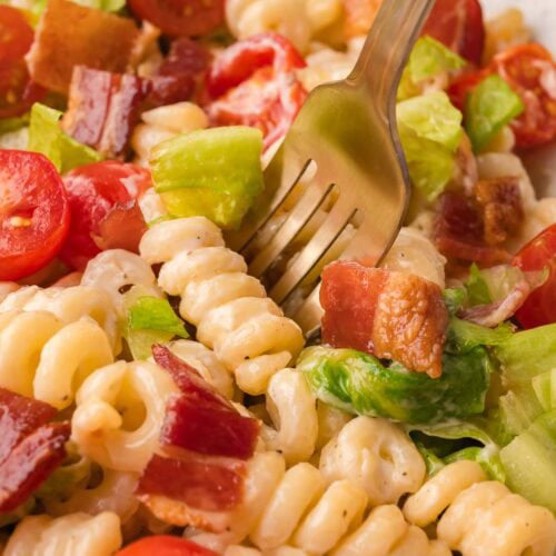 Bacon lettuce tomato pasta salad in a large white bowl for cookouts and parties.