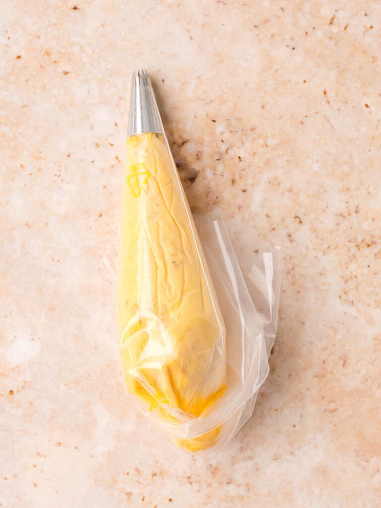 Deviled egg filling in a piping bag fitted with a star tip.