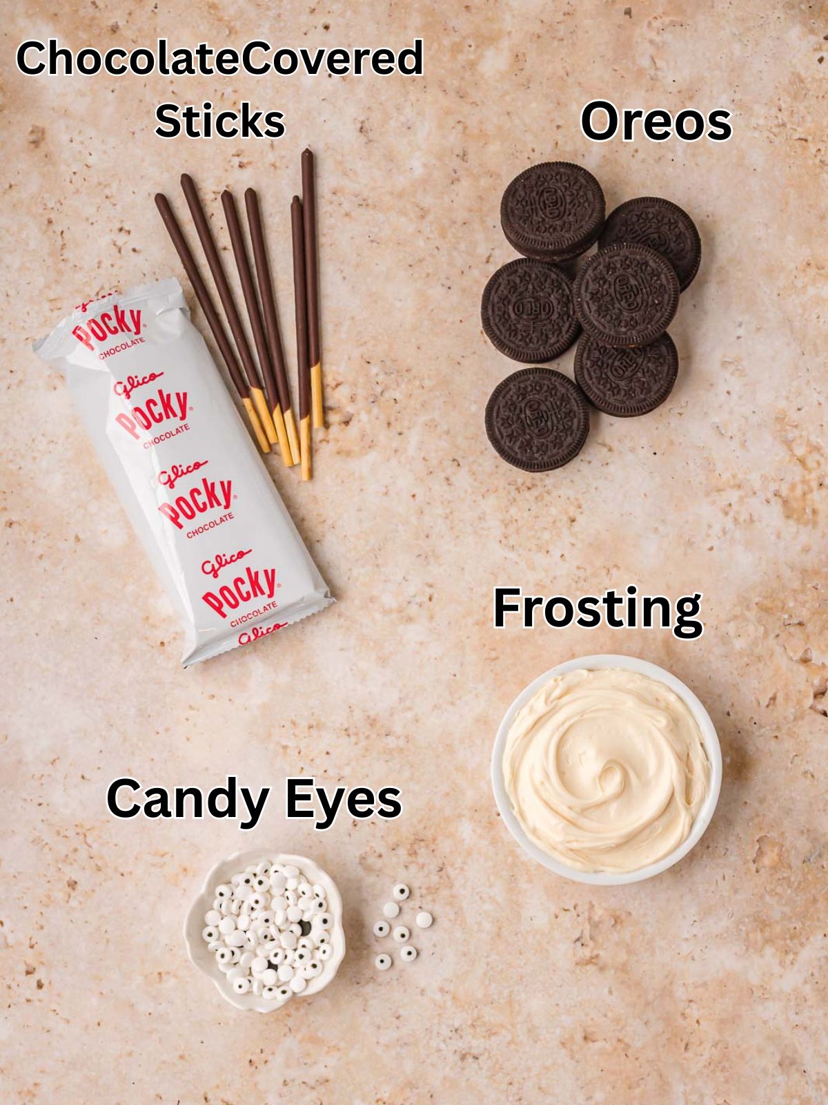 Ingredients for Oreo spider cookies including Oreos, chocolate covered biscuit sticks, frosting and candy eyeballs by Tessie's Table.