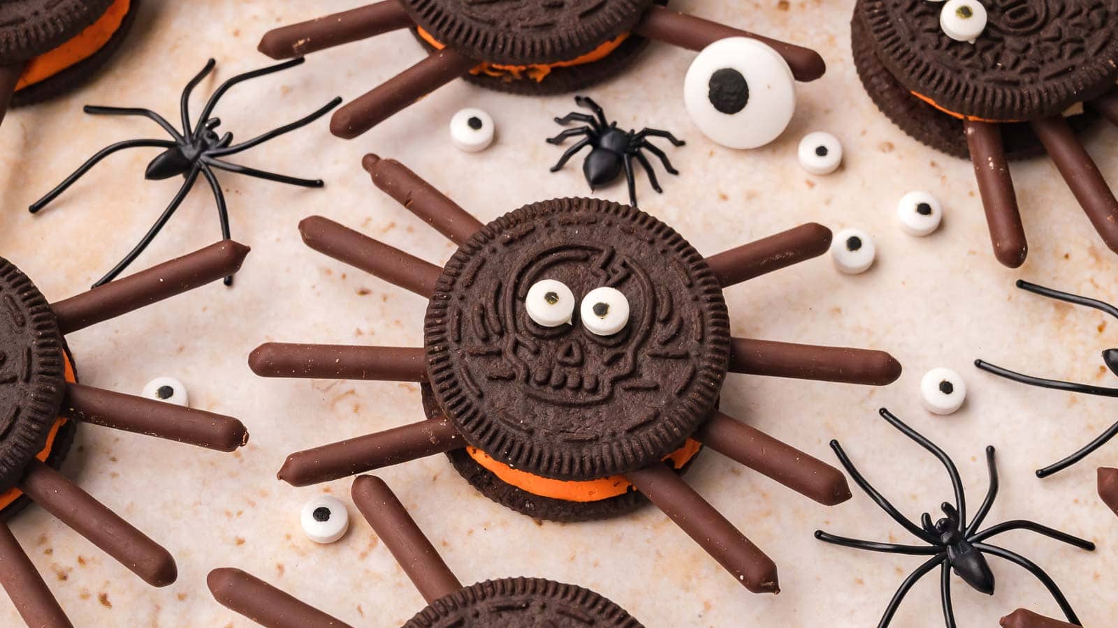 Overhead close up of an Oreo spider cookie made with a skull pattern Oreo by Tessie's Table.
