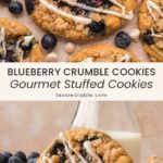 Overhead view of blueberry crumble cookies with crumble topping and white chocolate drizzle, and a cookie standing in front of a bottle of milk by Tessie's Table.