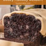 Chocolate Baileys banana bread cut open to show a dark chocolate crumb under white chocolate ganache.