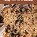 Close up of Oreo banana bread cut open to show Oreo pieces in a soft crumb.